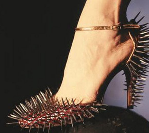 Lady high heel with sharp metal iron